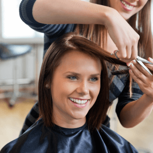 A women getting haircut